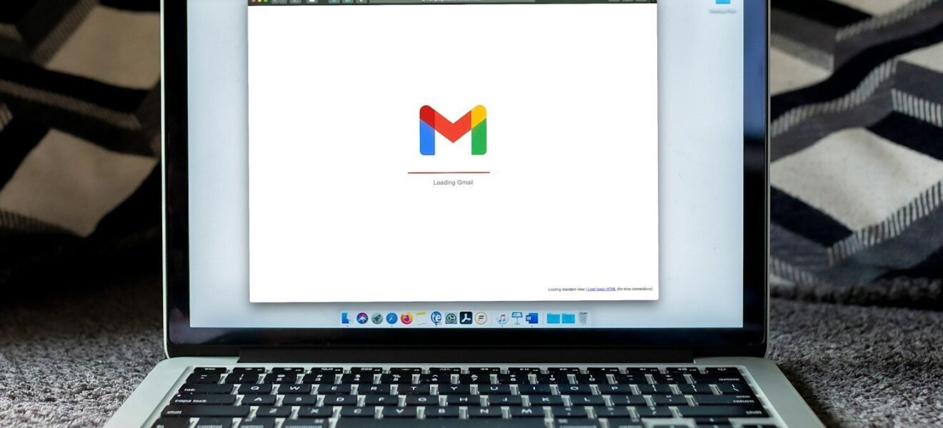 macbook pro on black textile