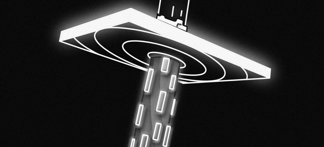 a black and white photo of a street light